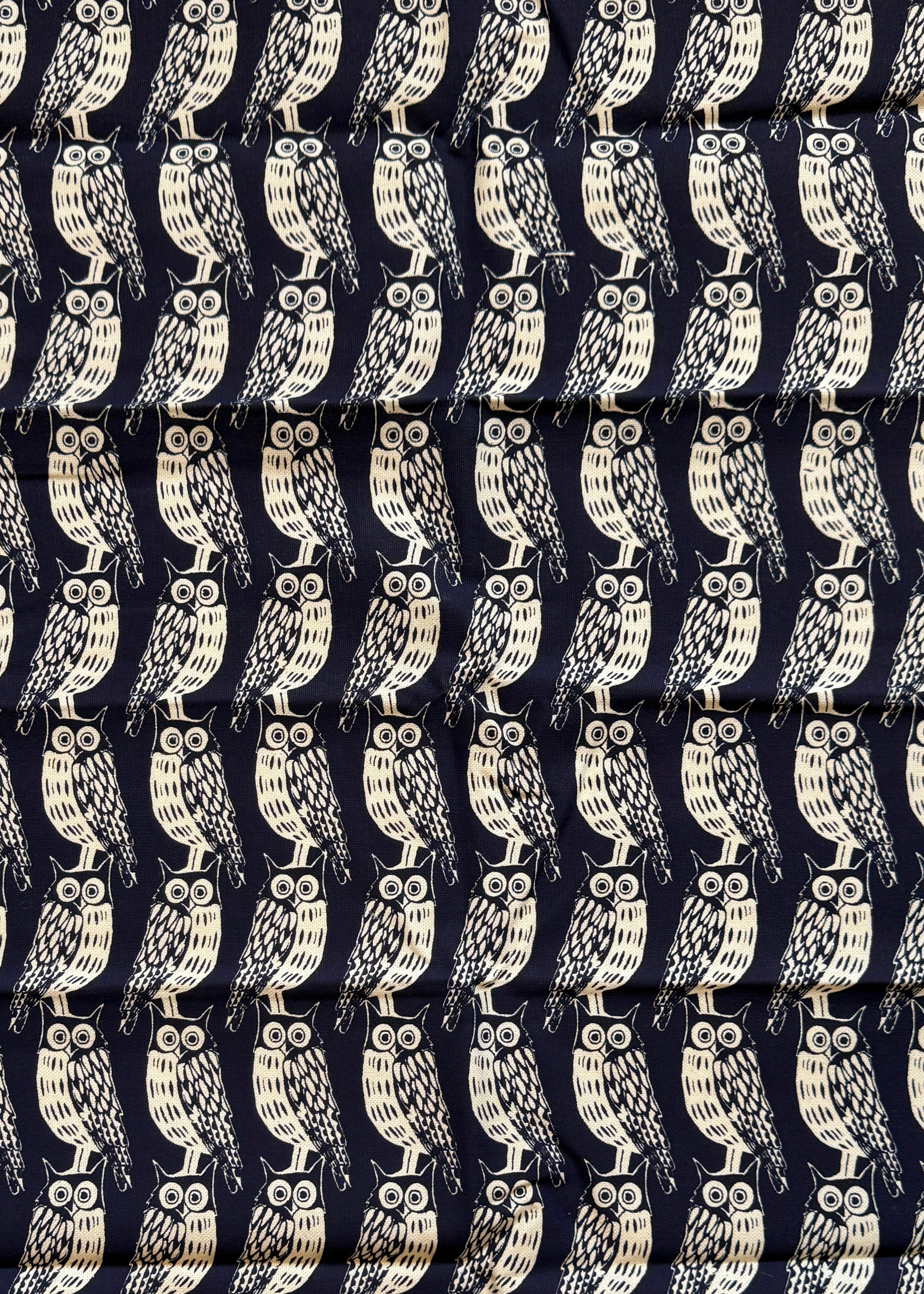 Navy blue fabric with white pattern and 'Cambridge Impprint' text on a white background